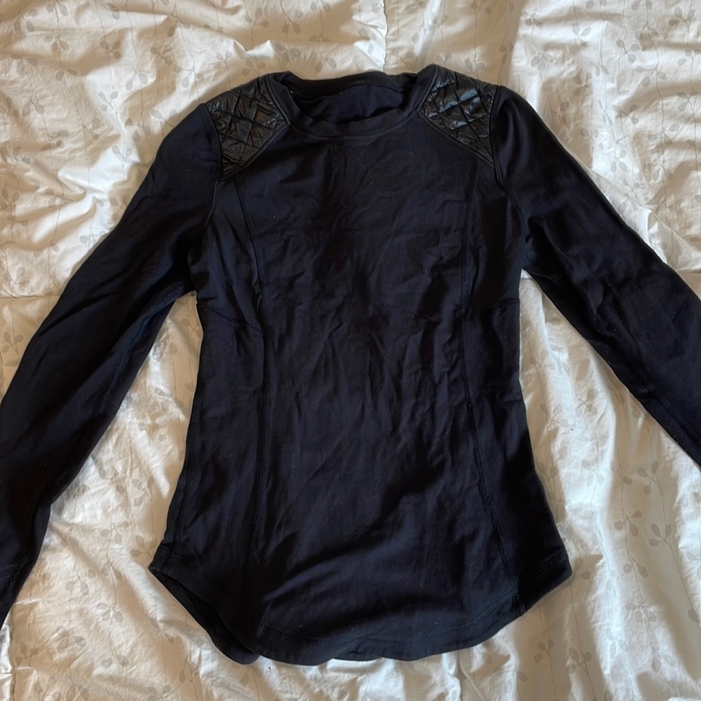 Black lululemon size 4 padded long sleeve shirt.